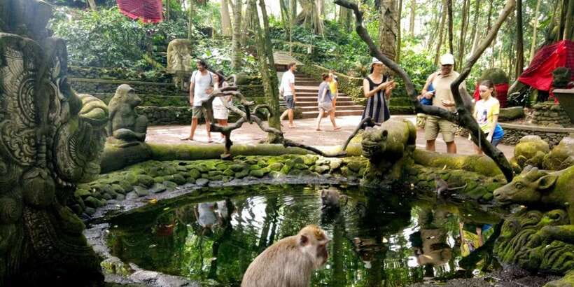 Bali: ATV Gorilla Cave, Ubud Monkey Forest, & Waterfall Tour - Cooling off at Tegenungan Waterfall