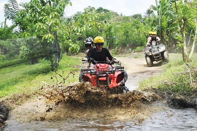 Bali ATV Quad Bike with Monkey Forest and Tegenungan Waterfall - Cleaning up after the mud