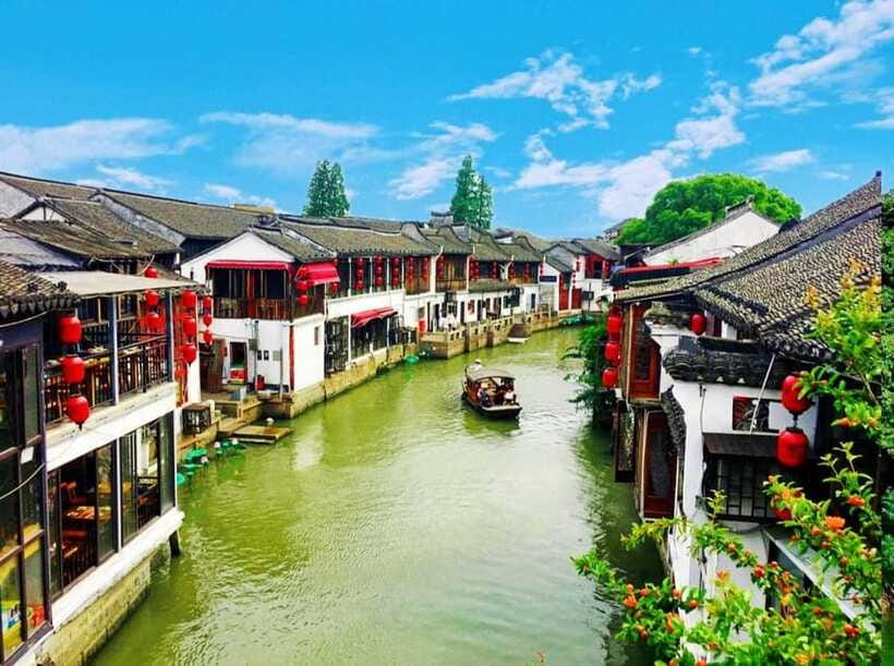 Shanghai: Zoo and Zhujiajiao Water Town Tour with Boat Ride - Stone-paved markets, food, and small purchases